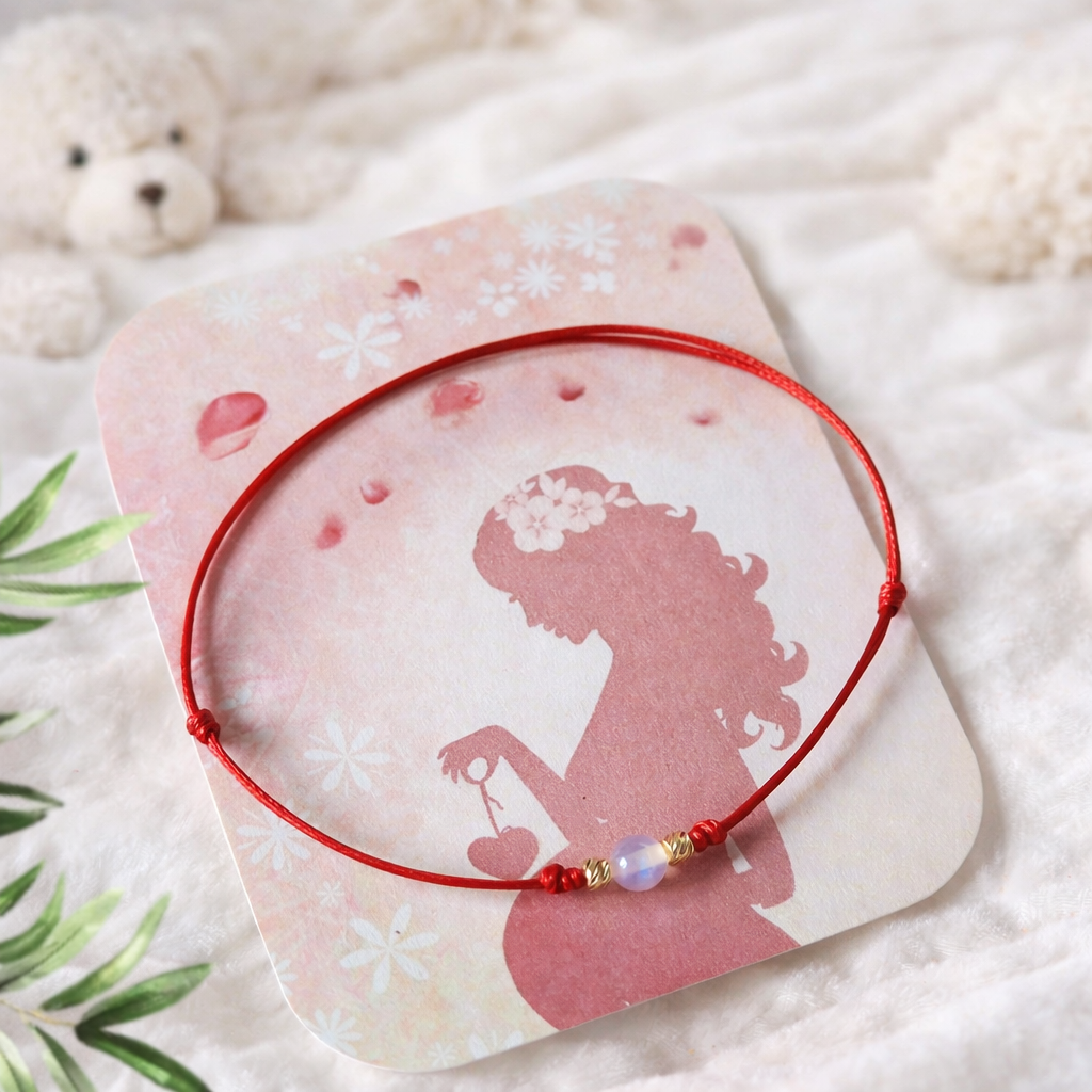 Гривна с лунен камък и злато червен конец подарък за бременна жена